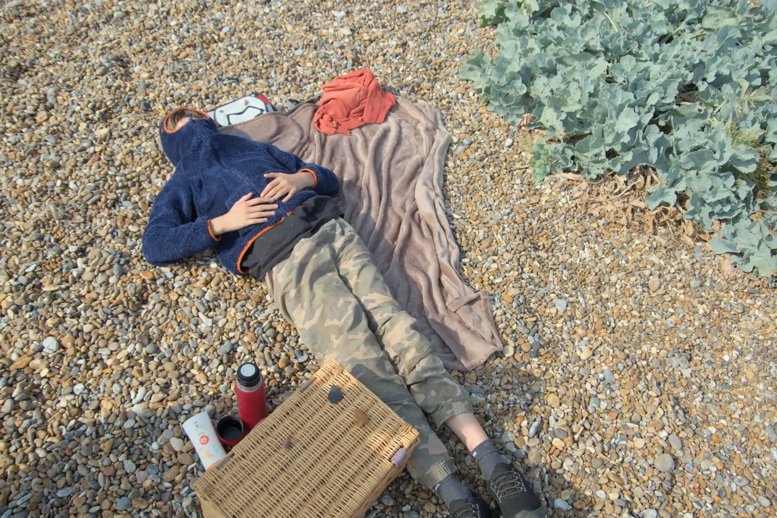 Harry flakes out with his hoodie up, from A Protest on the Beach, Aldeburgh, Suffolk - 1st September 2024