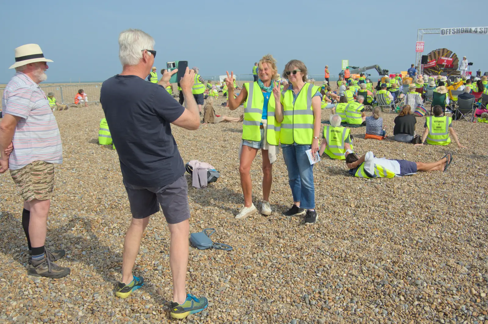 Victory signs from some protesters, from A Protest on the Beach, Aldeburgh, Suffolk - 1st September 2024