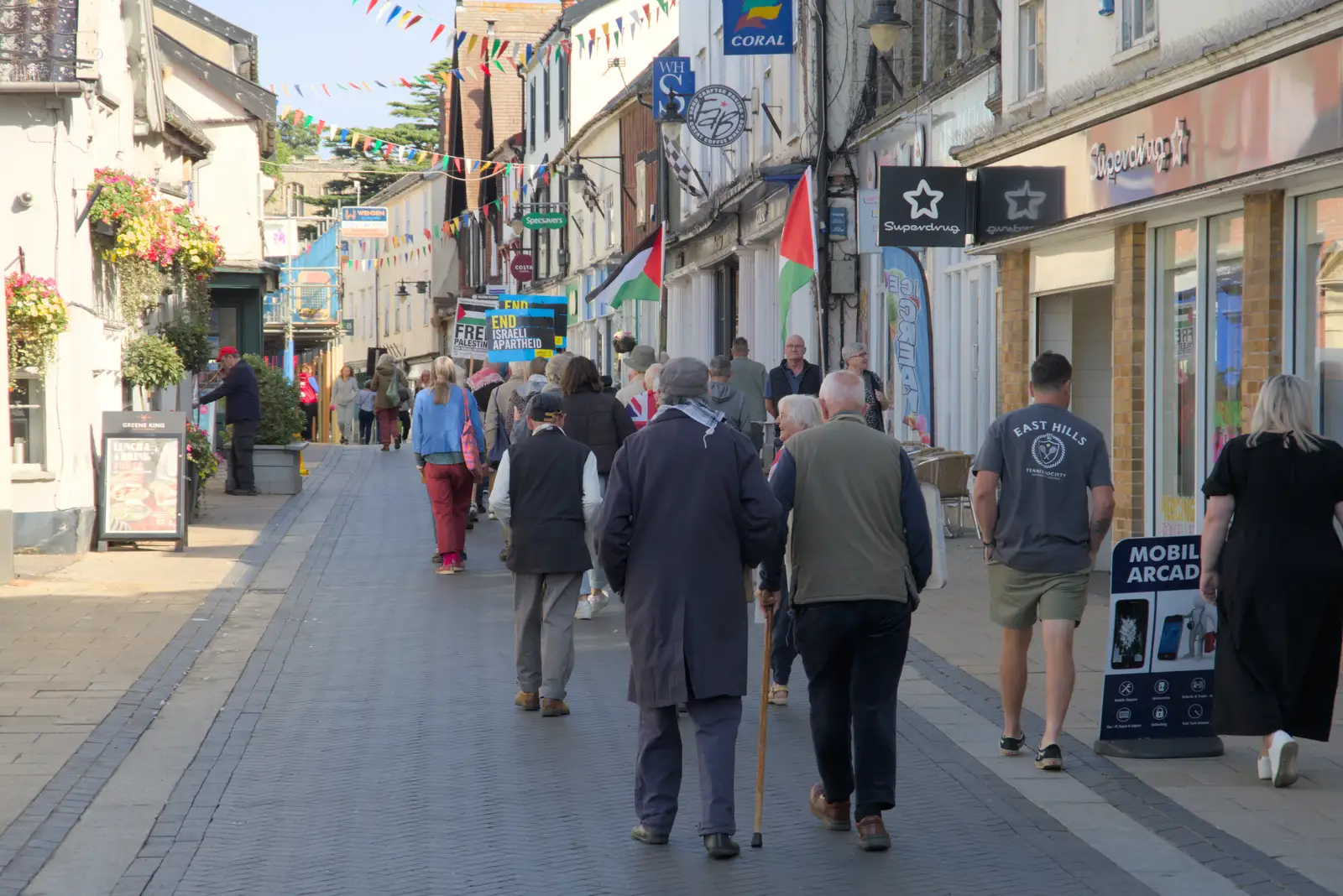 A protest moves up Mere Street, from Palgrave Players Busking and the GSB at Pulham Market, Norfolk - 14th September 2024