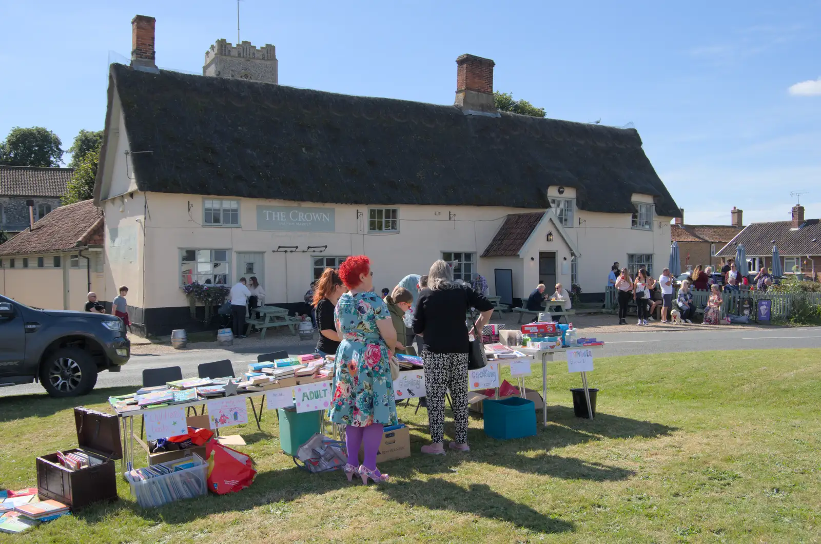 A book stall in front of the Crown pub, from Palgrave Players Busking and the GSB at Pulham Market, Norfolk - 14th September 2024