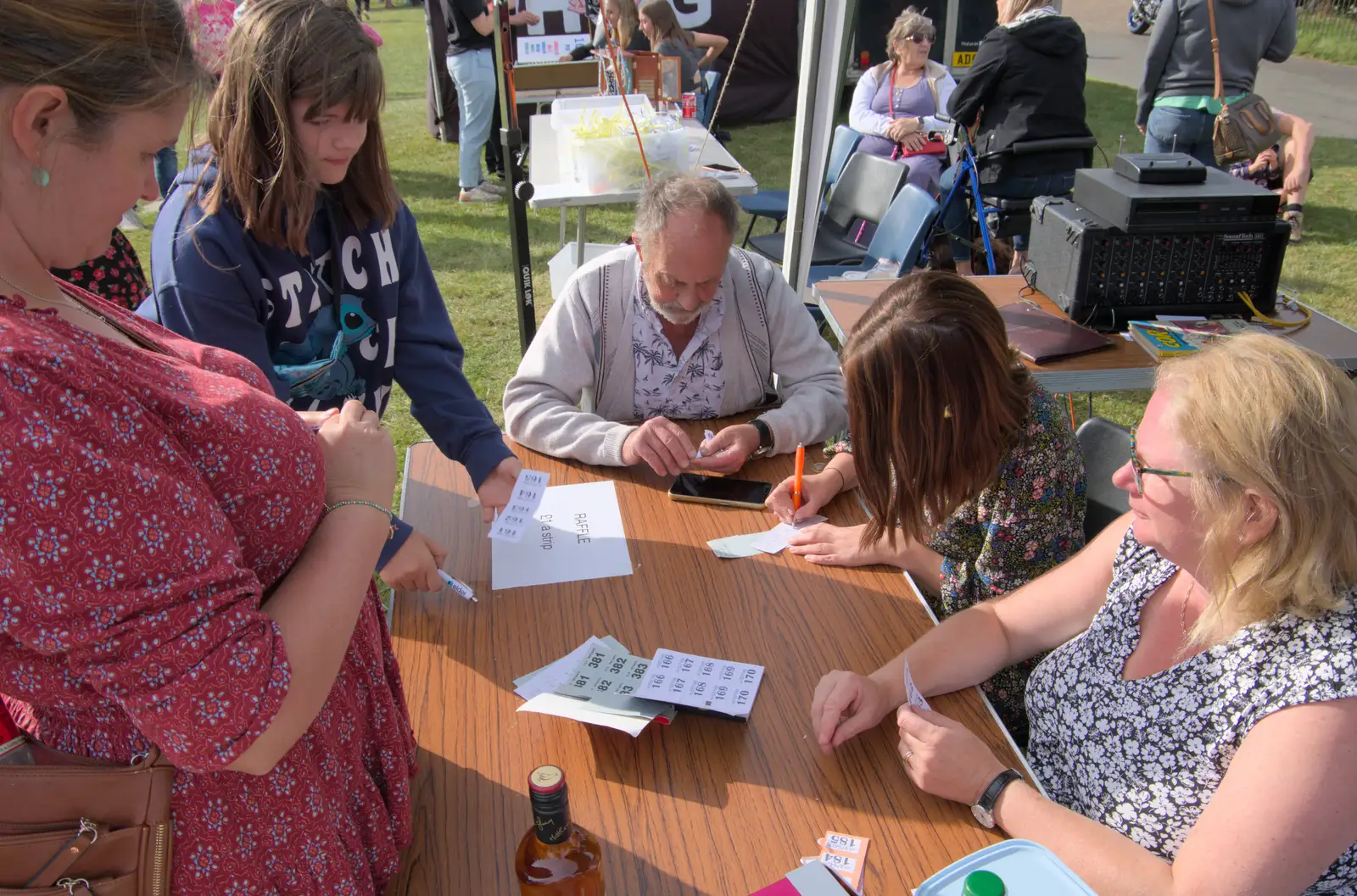 Isobel helps sort out the raffle, from Palgrave Players Busking and the GSB at Pulham Market, Norfolk - 14th September 2024