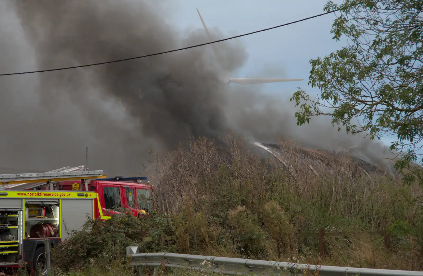 The smoking Nissen hut, from A Major Fire at Suffolk Highways, Brome, Suffolk - 15th September 2024