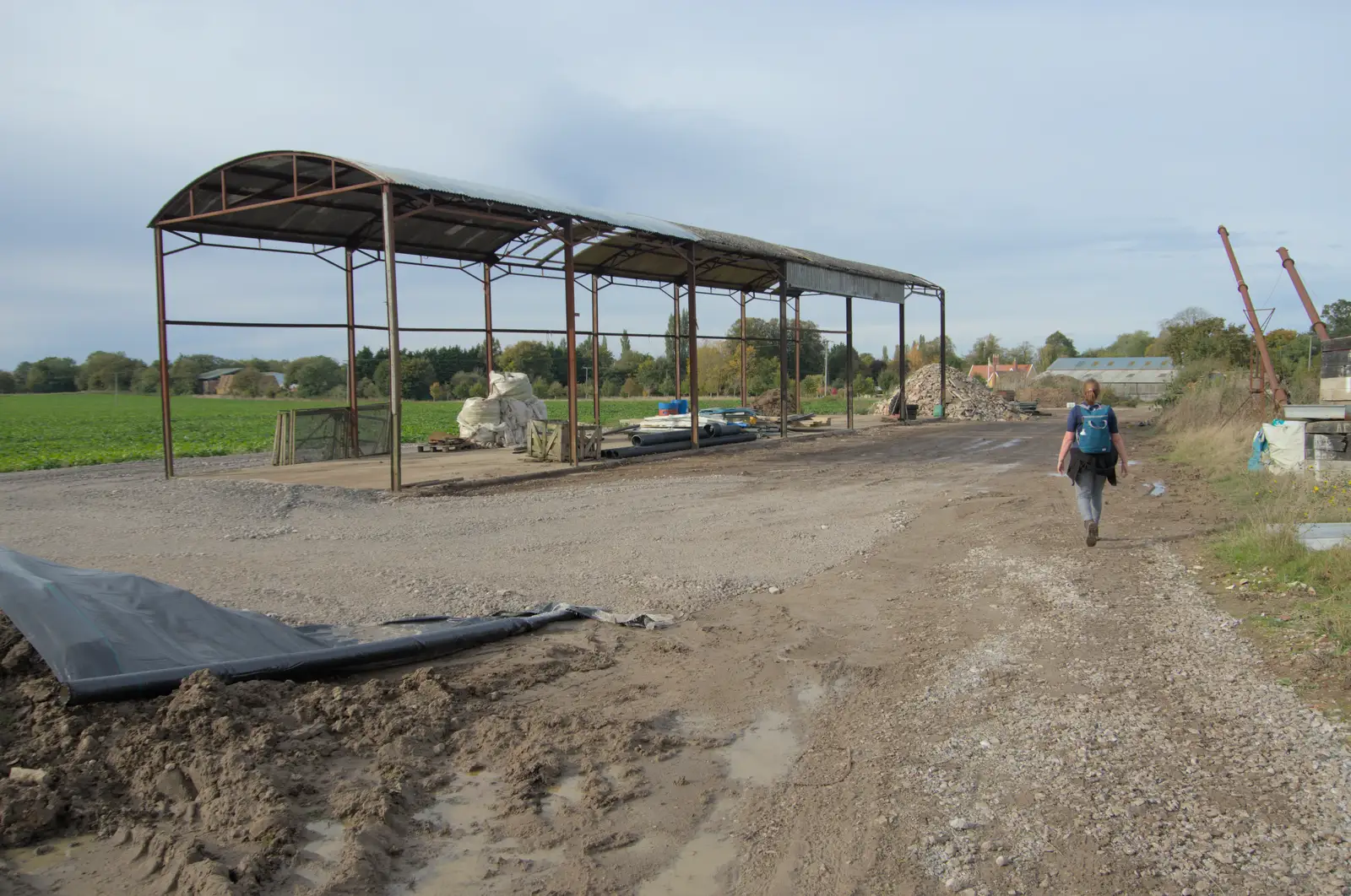 Isobel wanders past a wrecked farm building, from A Walk to the Railway Tavern, Mellis, Suffolk - 13th October 2024