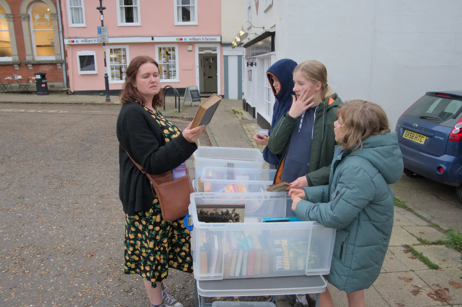 Isobel checks out some secondhand books, from The Witchfinder General at Framlingham Castle, Suffolk - 26th October 2024