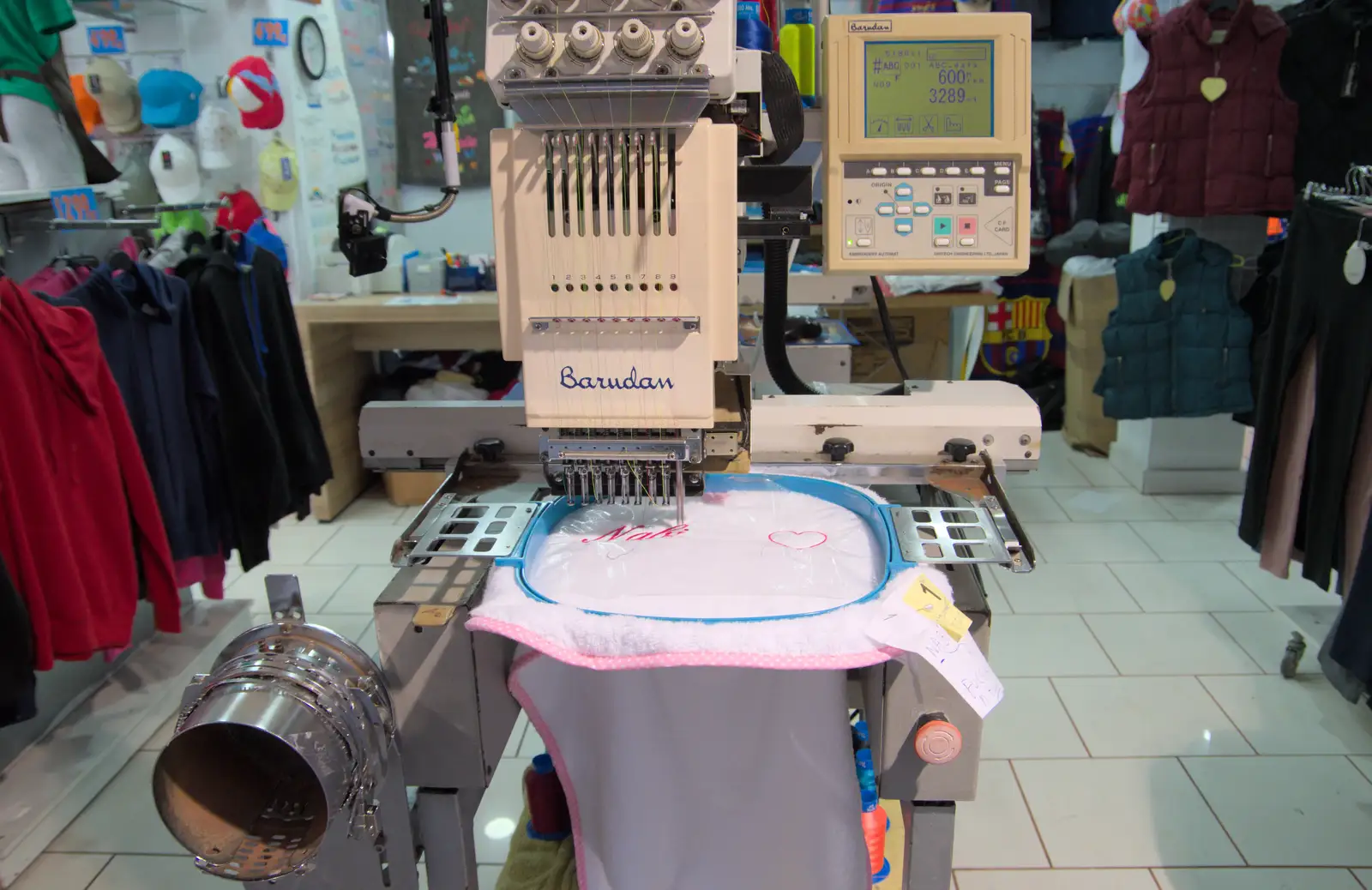 A sewing machine embroiders a name into a teeshirt, from A Trip to Lloret de Mar, Catalonia, Spain - 27th October 2024