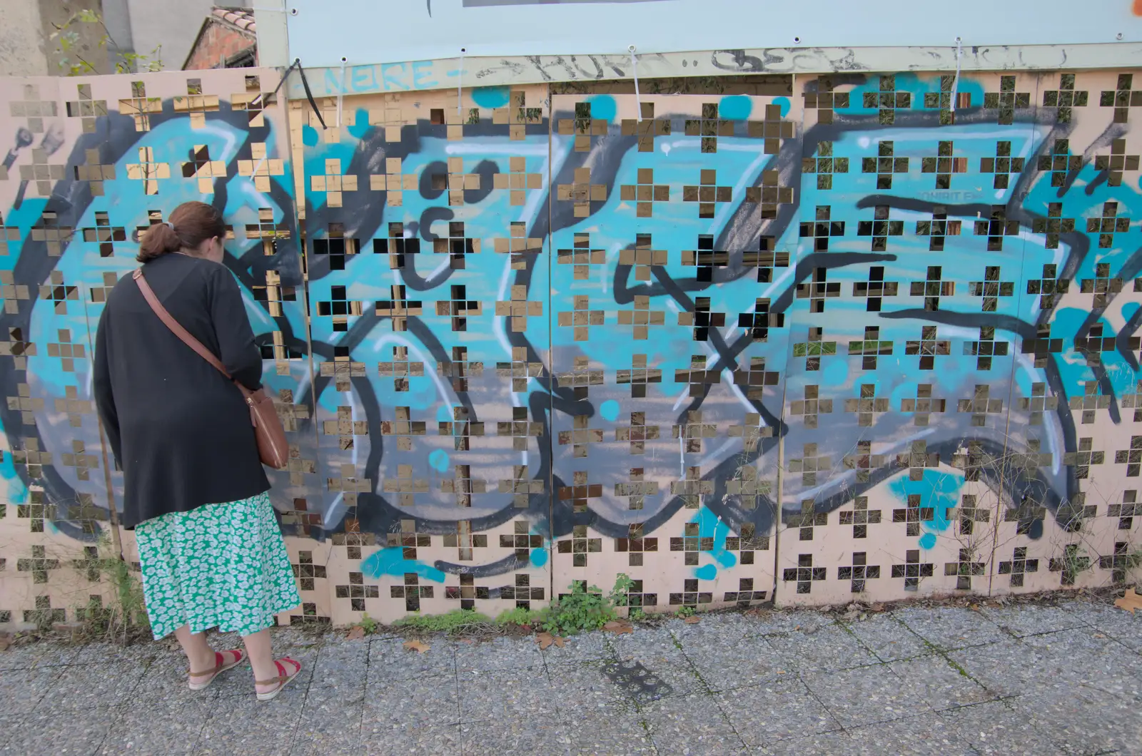 Isobel peers at a hidden derelict building, from A Return to Girona, Catalunya, Spain - 29th October 2024