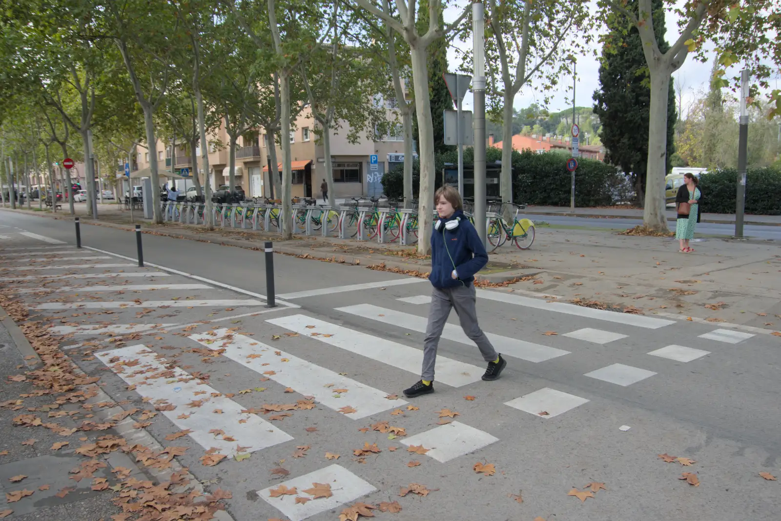 Harry strides over a zebra crossing, from A Return to Girona, Catalunya, Spain - 29th October 2024