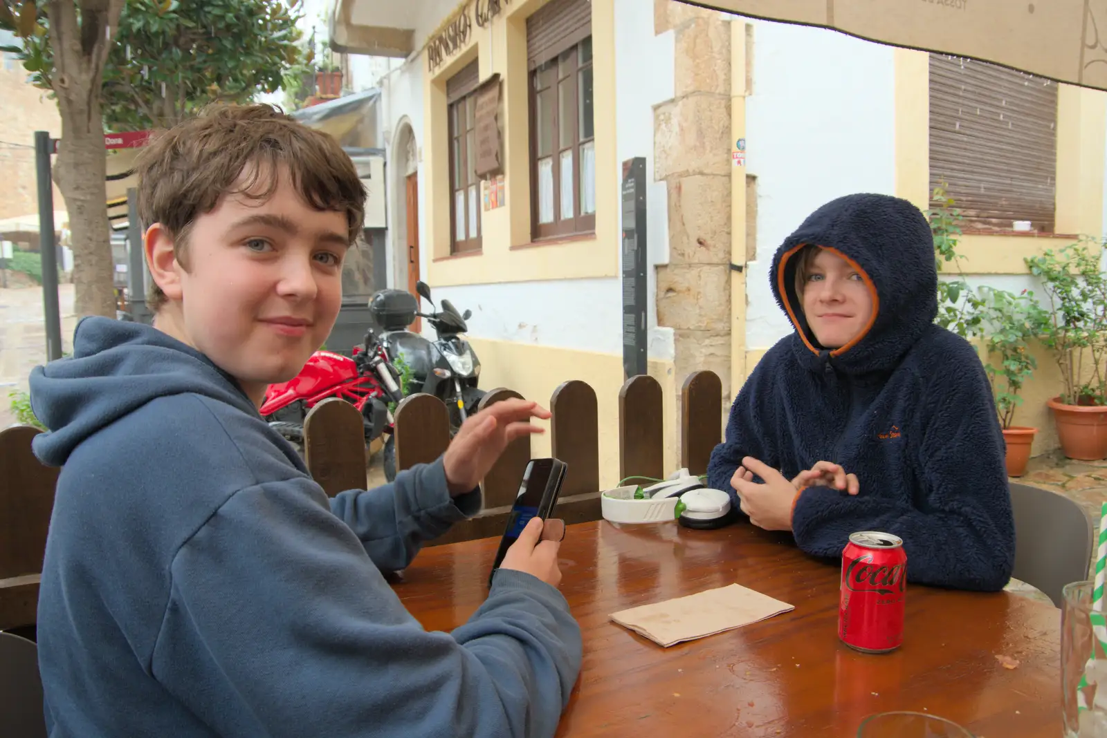 Fred and Harry are playing phone games, from A Postcard From Tossa de Mar, Catalunya, Spain - 30th October 2024