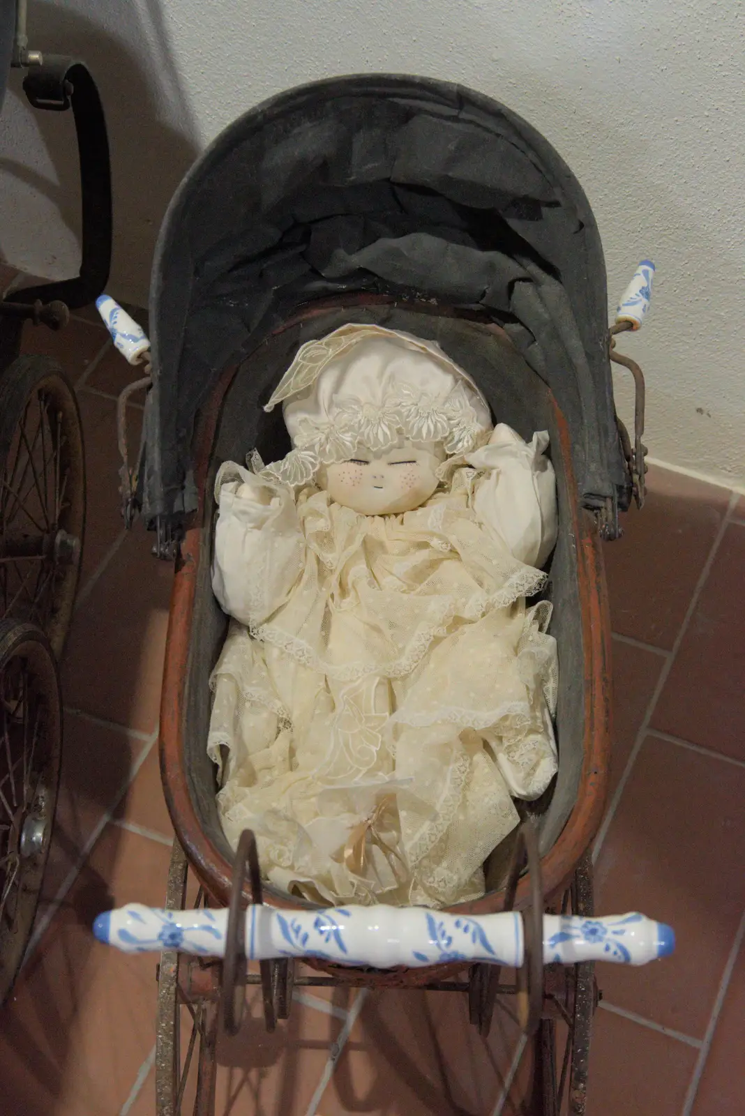 A slightly horror-film doll in a pram, from A Postcard From Tossa de Mar, Catalunya, Spain - 30th October 2024