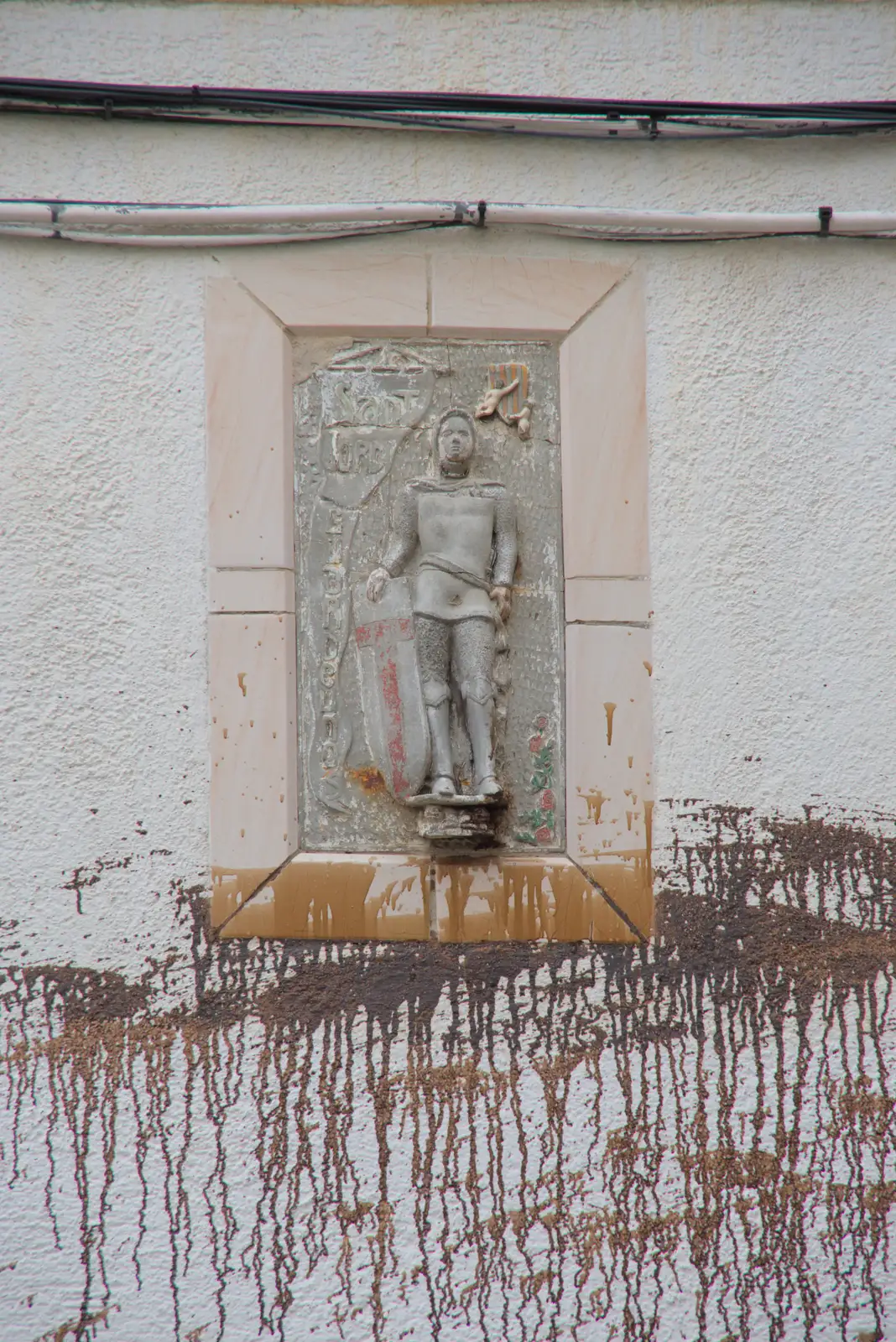 Paint on a wall below a statue, from A Postcard From Tossa de Mar, Catalunya, Spain - 30th October 2024