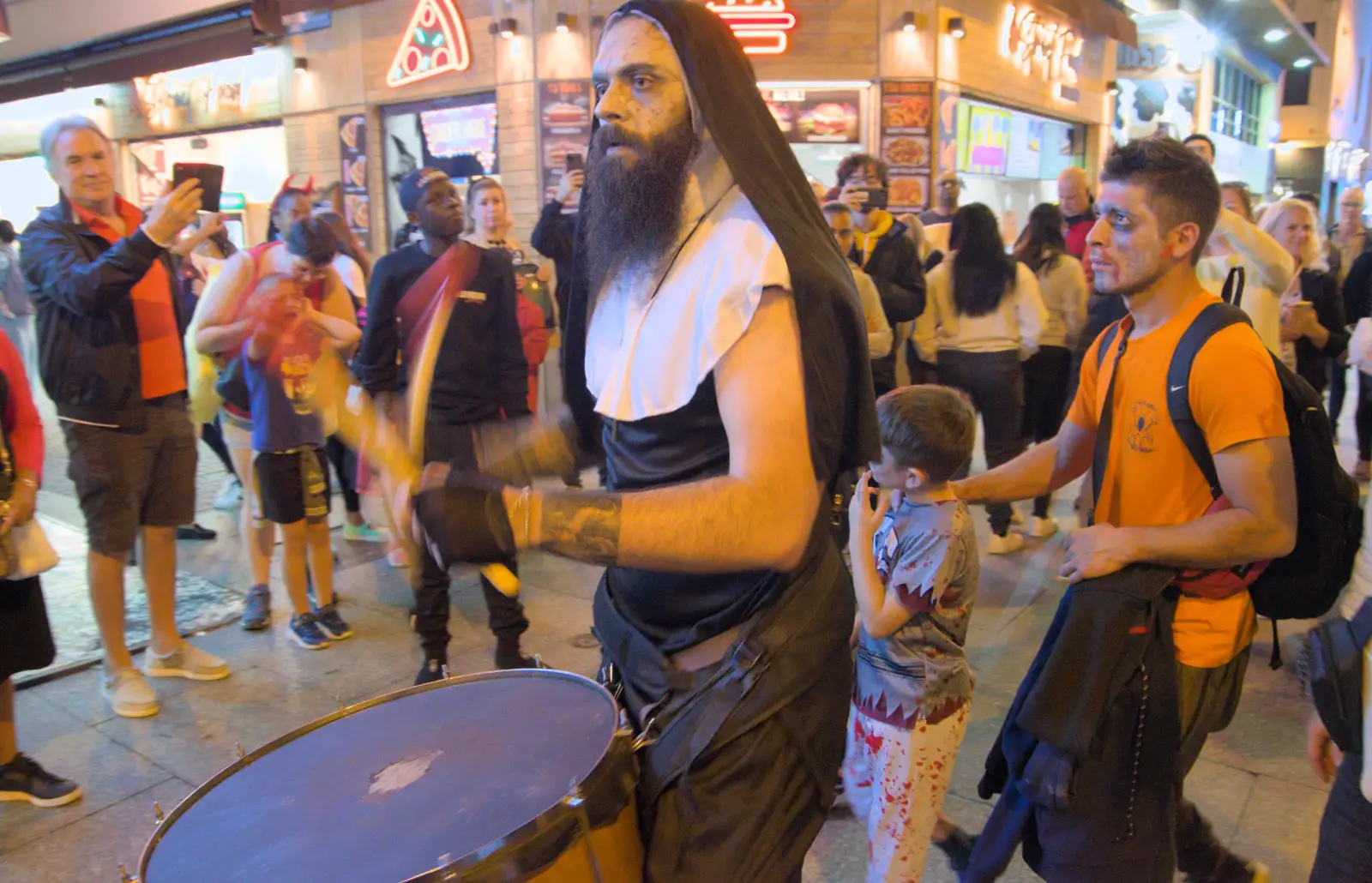 A bearded nun plays a bass drum, from Halloween and Flamenco Guitar, Lloret de Mar, Catalunya, Spain - 31st October 2024