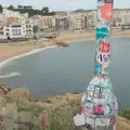 A lampost on a hill with a lot of stickers, Blanes, and the Castanyada Festival, Lloret de Mar, Catalunya - 1st November 2024