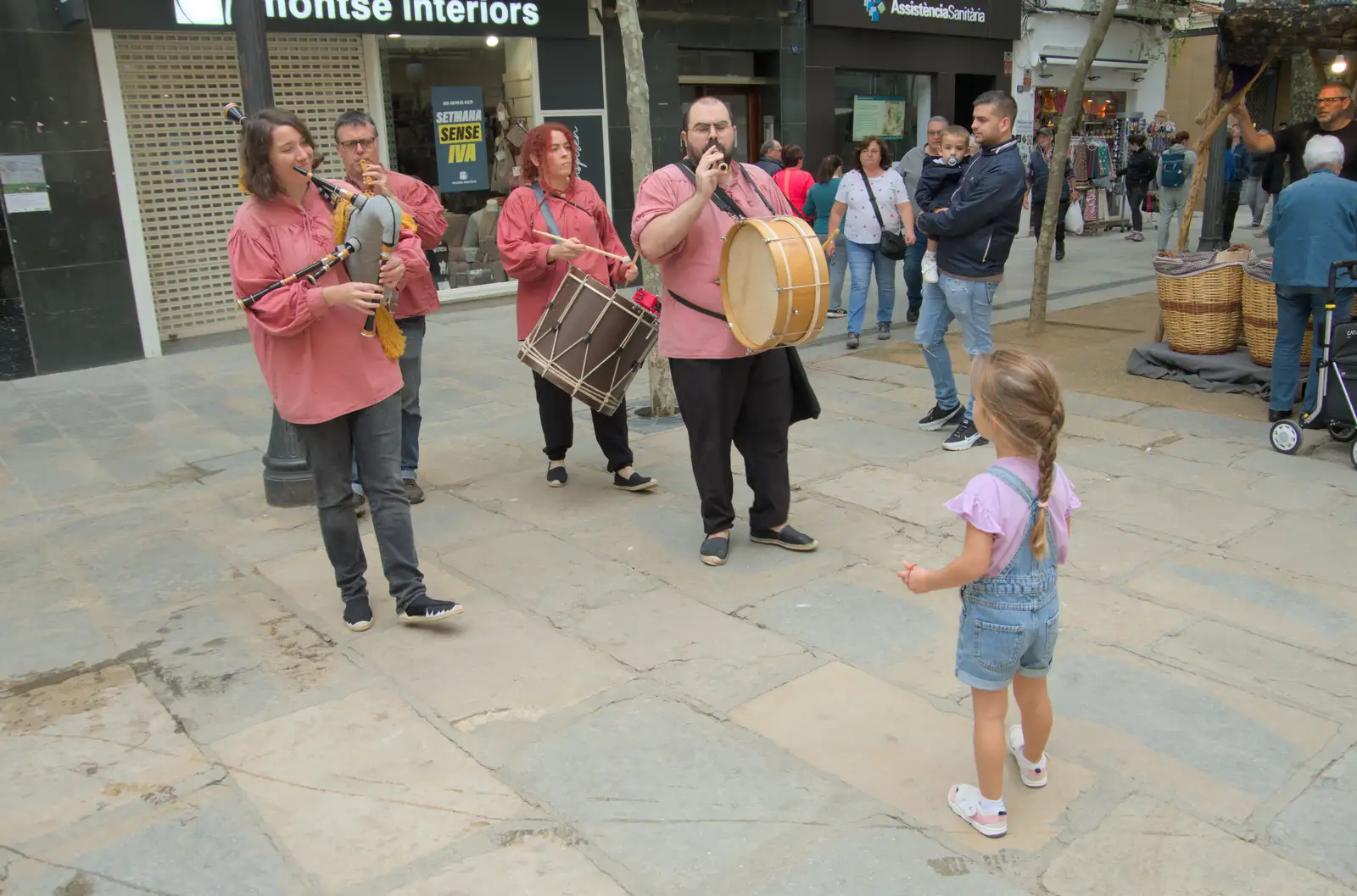 A small girl watches the music, from Blanes, and the Castanyada Festival, Lloret de Mar, Catalunya - 1st November 2024