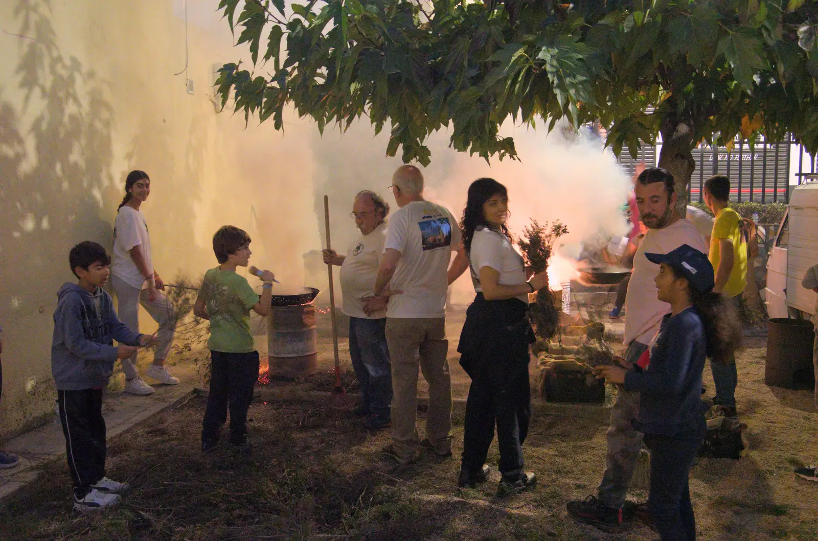 People hang around by the bonfires, from Blanes, and the Castanyada Festival, Lloret de Mar, Catalunya - 1st November 2024