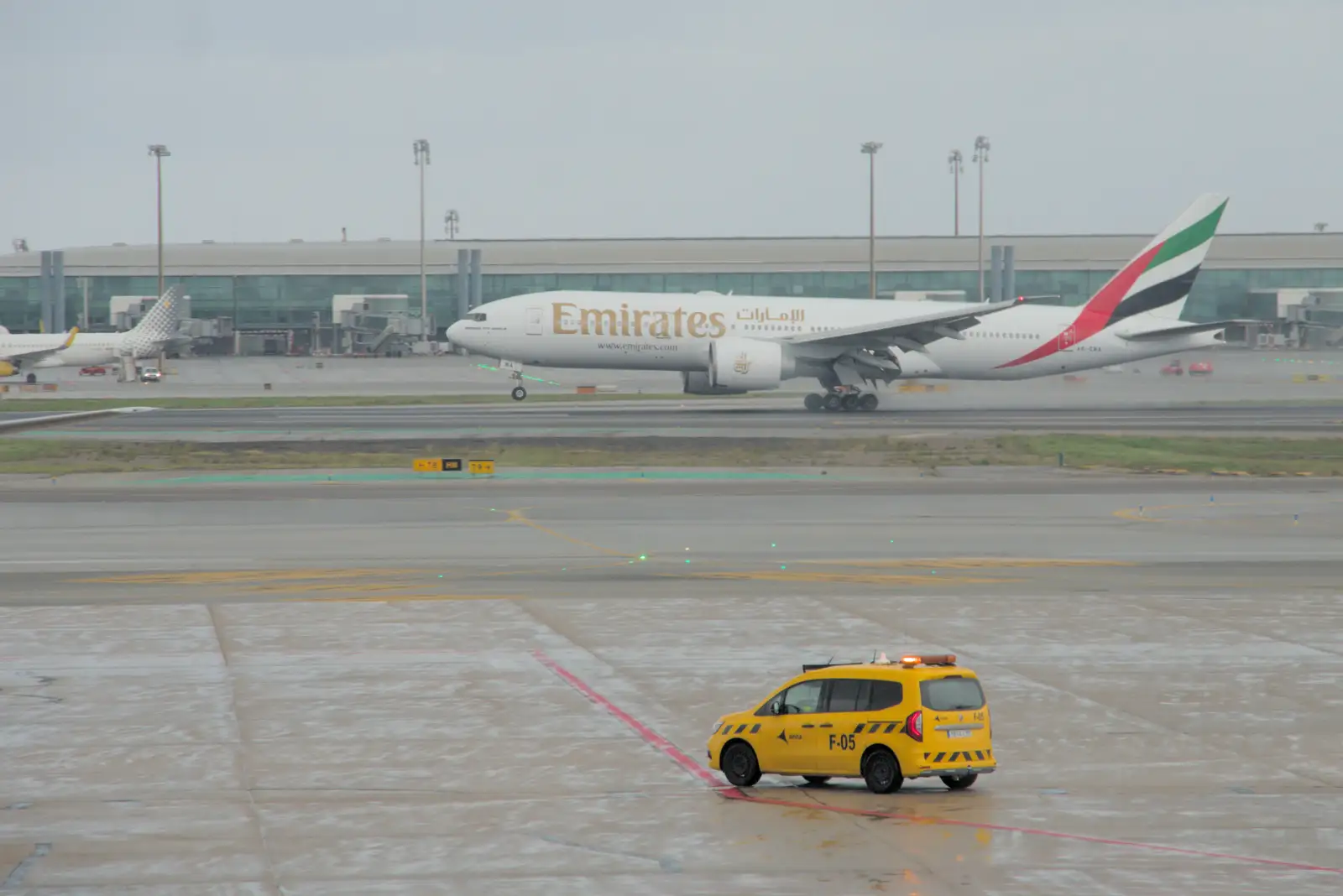 An Emirates 777 touches down, from Blanes, and the Castanyada Festival, Lloret de Mar, Catalunya - 1st November 2024