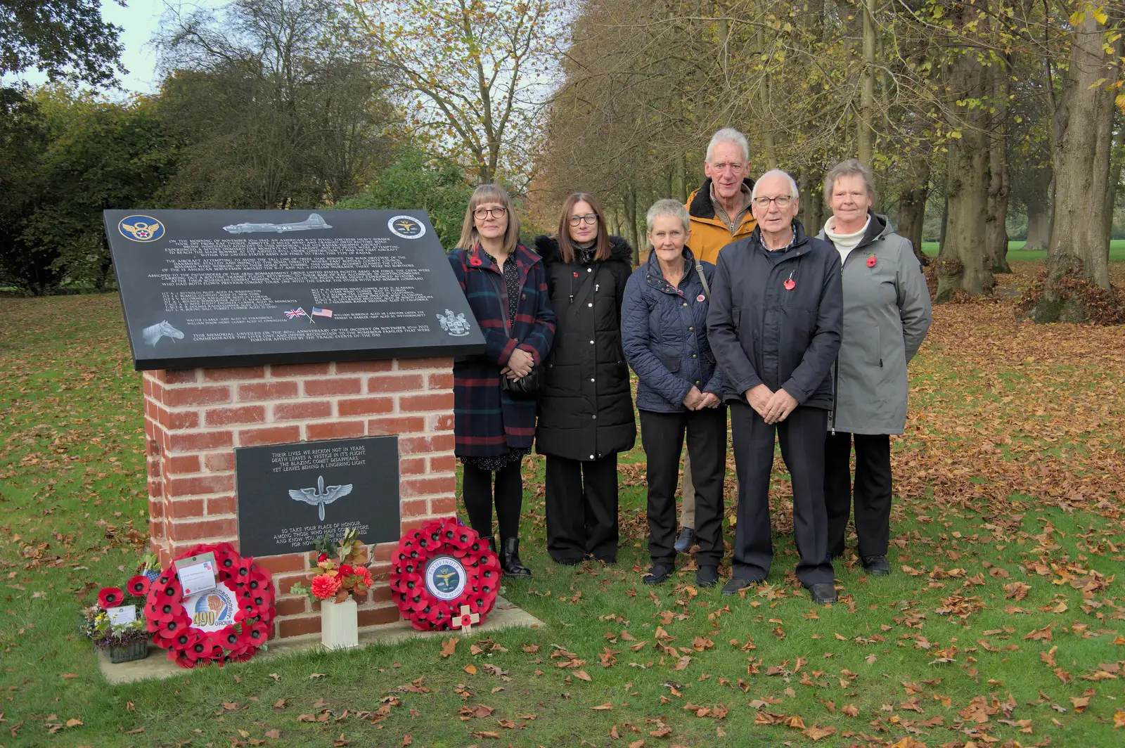 Relatives of the council workers by the memorial, from Remembrance Sunday with the GSB, Brome and Botesdale, Suffolk - 10th November 2024