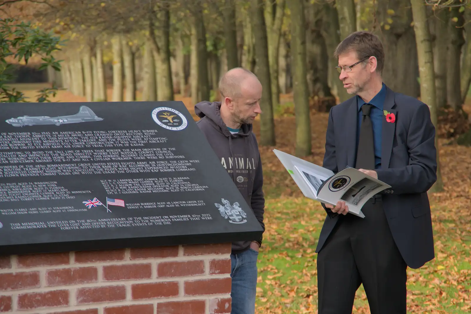 Steve flicks through a book, from Remembrance Sunday with the GSB, Brome and Botesdale, Suffolk - 10th November 2024