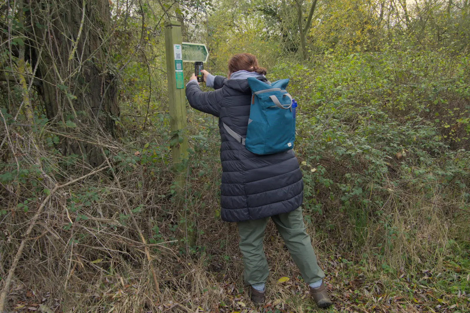 Isobel scans a QR code on a sign, from A Pub Walk to Ampersand, Diss, Norfolk - 17th November 2024