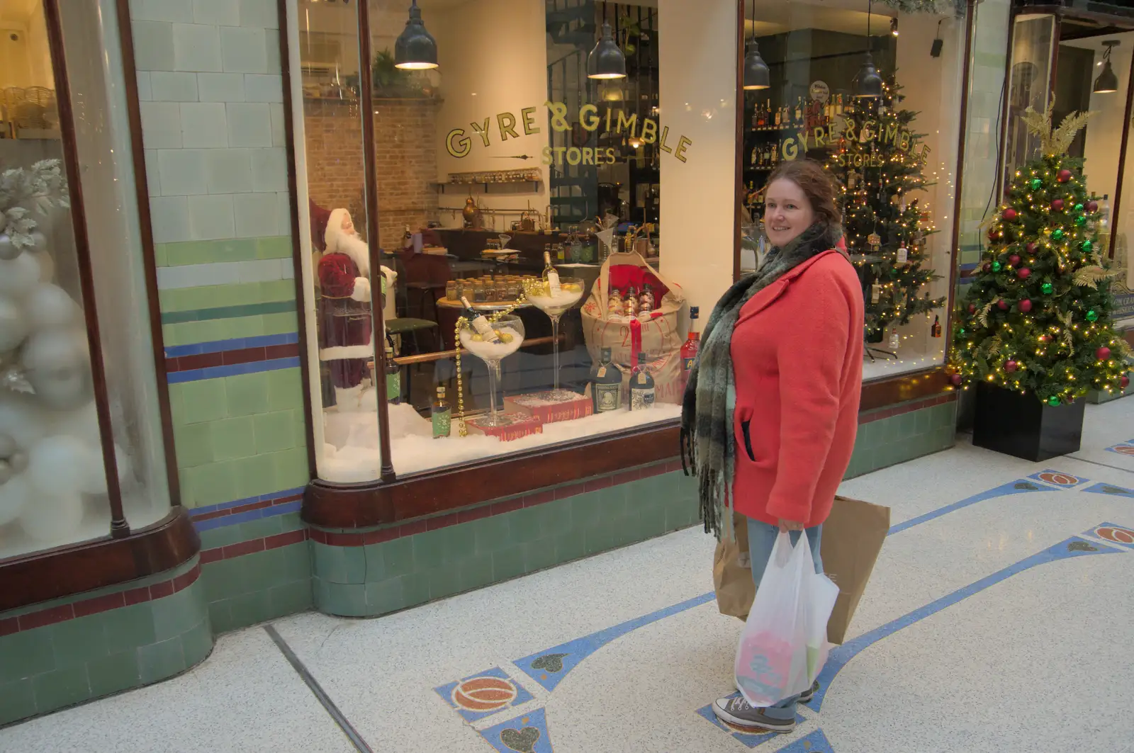 Isobel peers into a fancy shop window, from Christmas Shopping in Norwich, Norfolk - 8th December