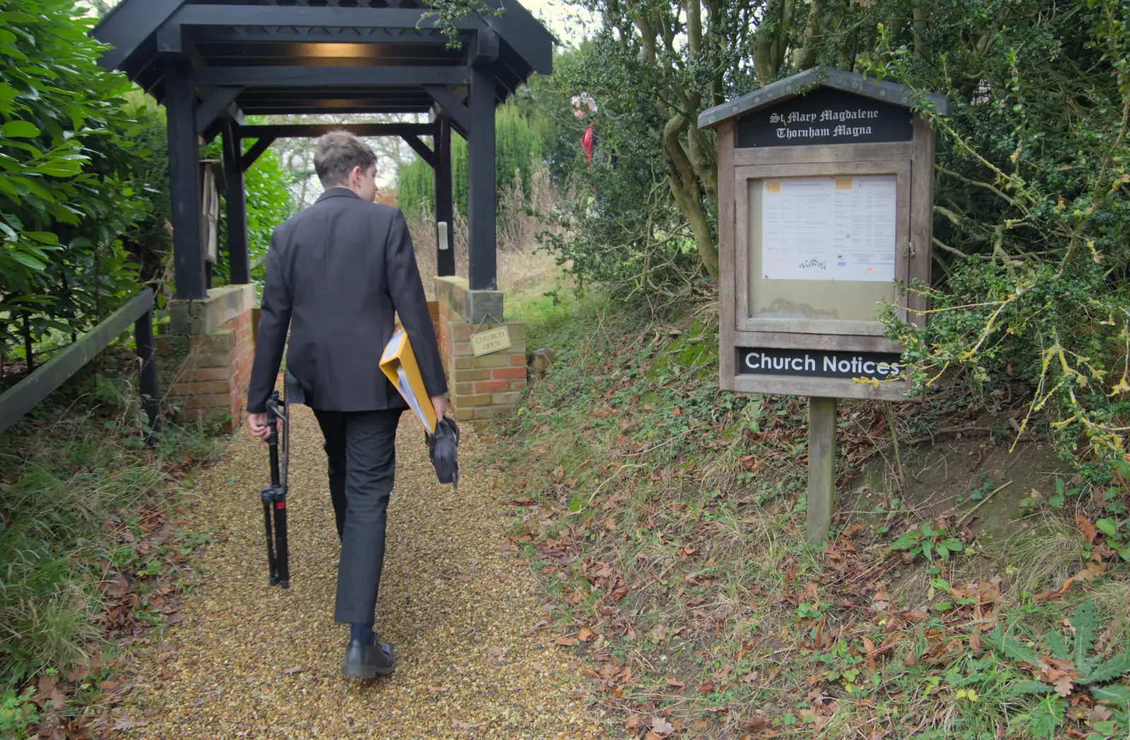 Fred wanders up to the lych gate, from A Weekend of Music with the GSB, Gislingham and Thornham - 15th December 2024