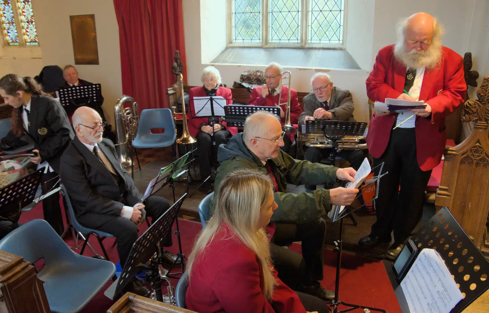 David adjusts some music, from A Weekend of Music with the GSB, Gislingham and Thornham - 15th December 2024