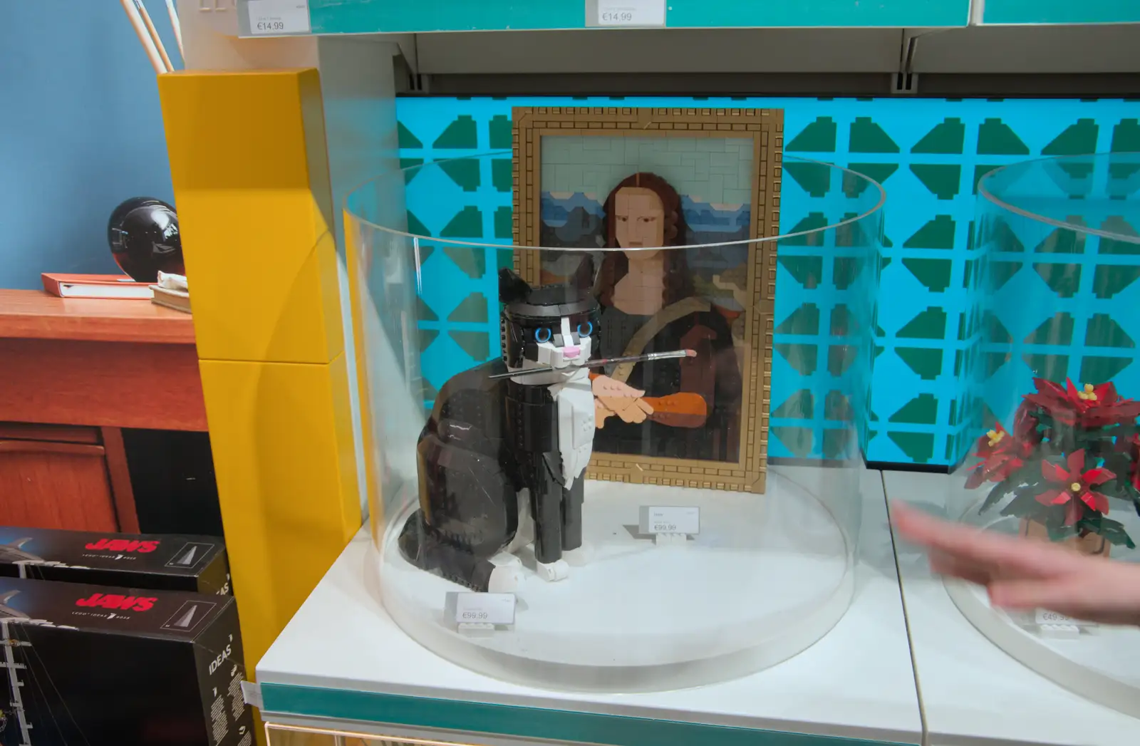 Tuxedo Cat paints the Mona Lisa in the Lego shop, from St. Stephen's Day in Blackrock, County Dublin, Ireland - 26th December 2024