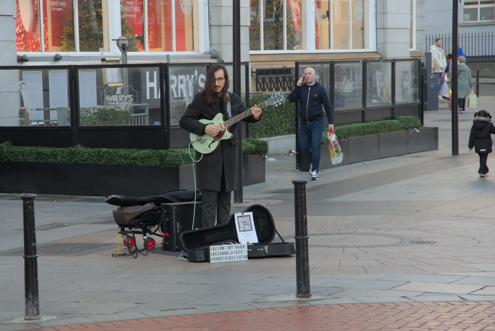 A guitarist plays Ain't no Sunshine, from St. Stephen's Day in Blackrock, County Dublin, Ireland - 26th December 2024