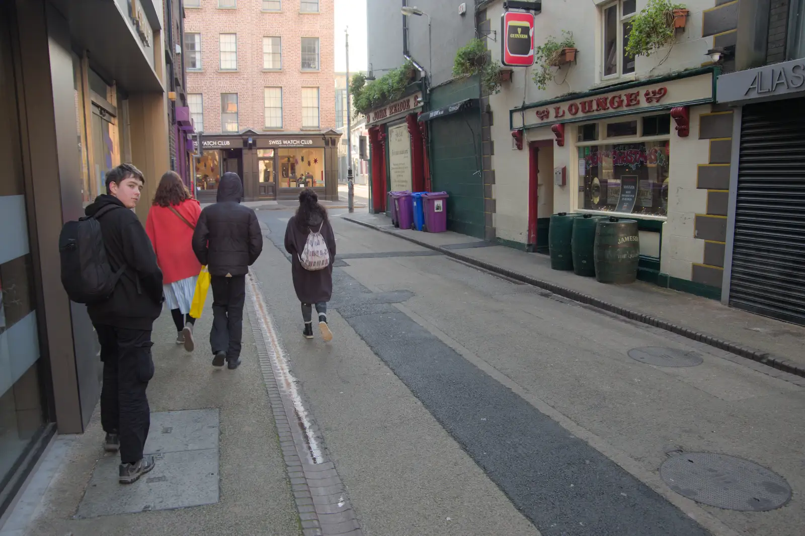 Fred looks back as we walk the streets of Dublin, from St. Stephen's Day in Blackrock, County Dublin, Ireland - 26th December 2024