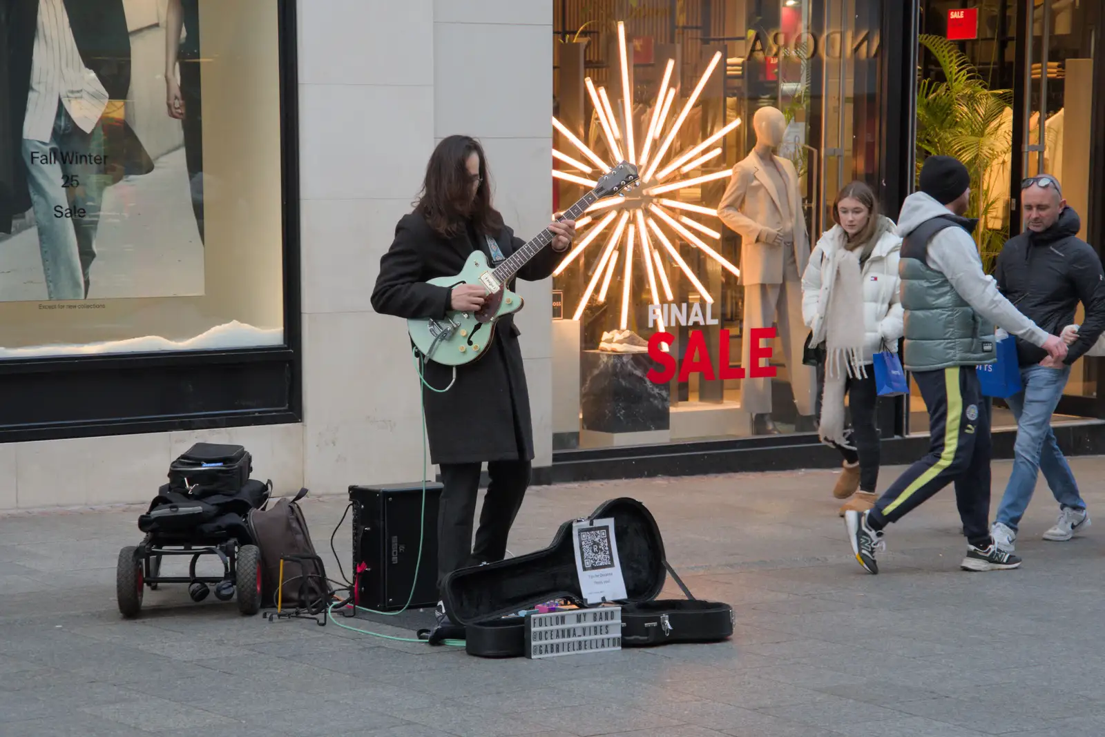 The busker is still playing Ain't no Sunshine, from St. Stephen's Day in Blackrock, County Dublin, Ireland - 26th December 2024