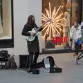 The busker is still playing Ain't no Sunshine, St. Stephen's Day in Blackrock, County Dublin, Ireland - 26th December 2024