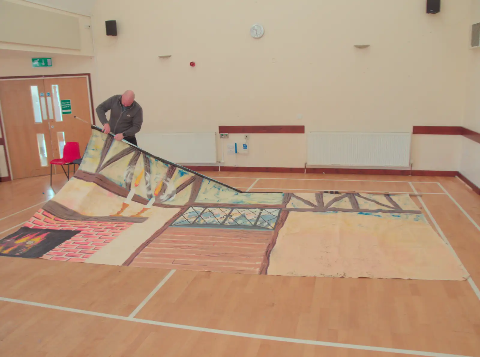 Will is unpicking staples from the backdrop, from Dove Players do Treasure Island, The Village Hall, Occold - 11th January 2025