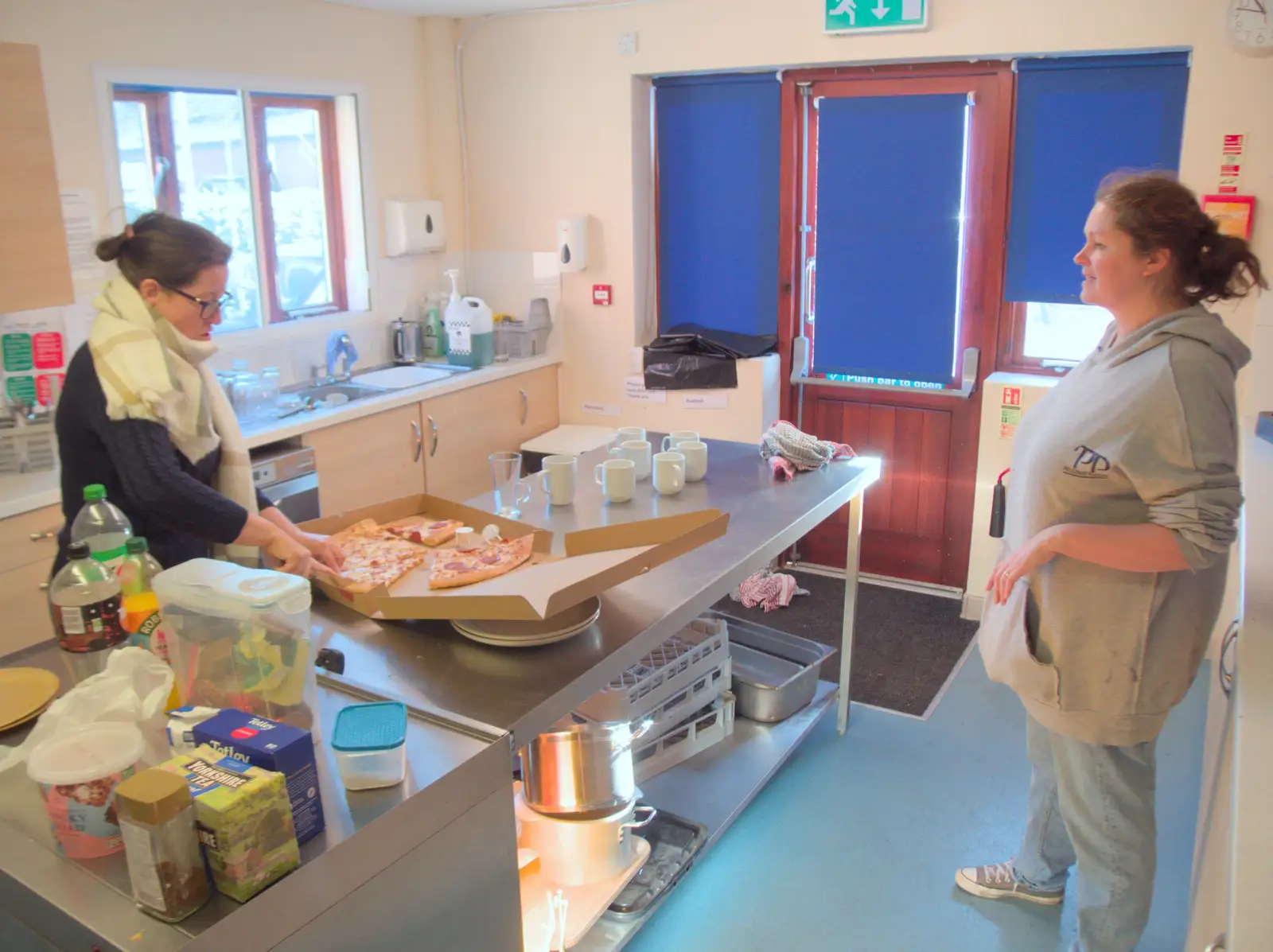 Suzanne and Isobel sort out left-over pizza, from Dove Players do Treasure Island, The Village Hall, Occold - 11th January 2025