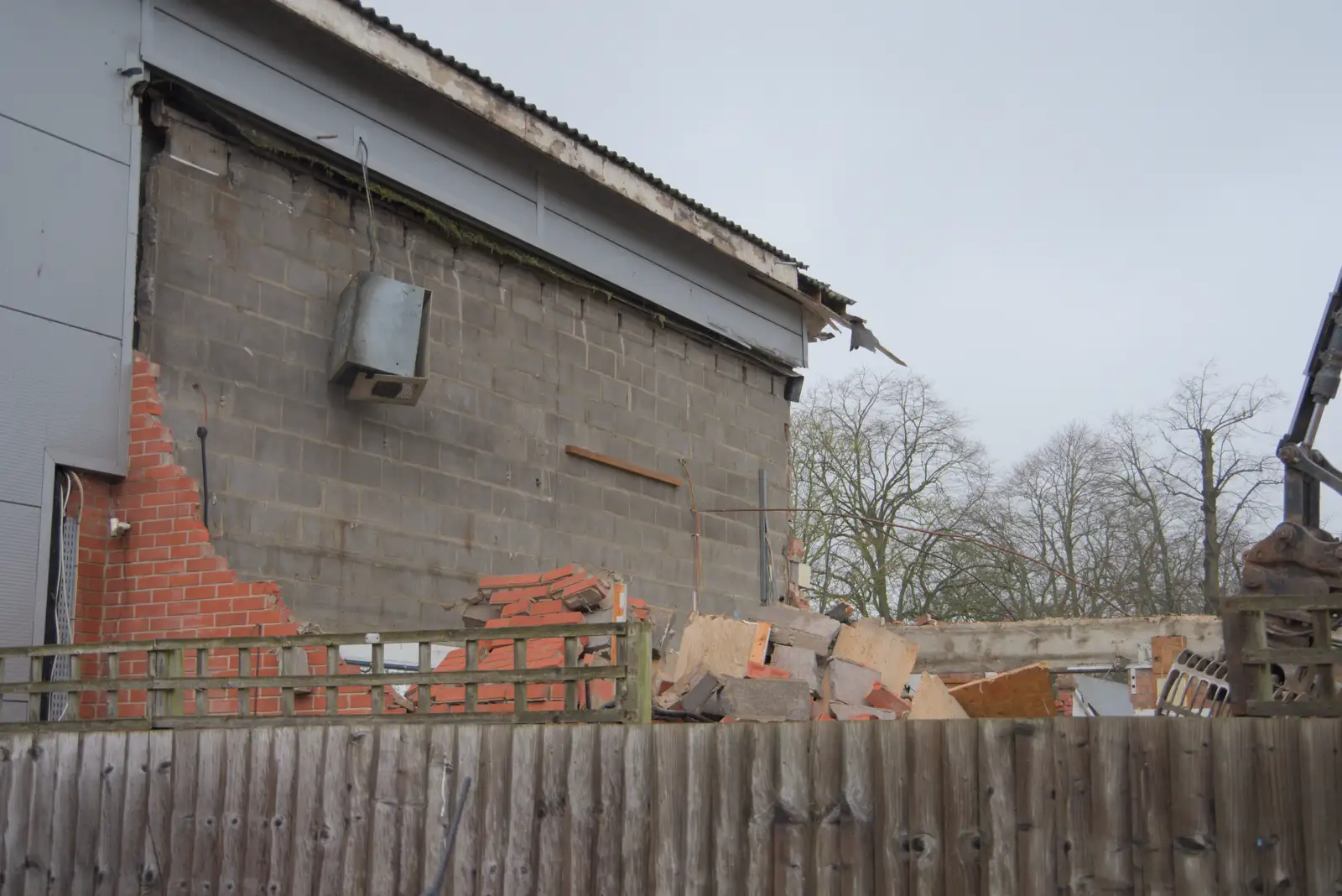 An air-conditioning unit hangs by its cable, from The Demolition of Park Road, Diss, Norfolk - 1st February 2025