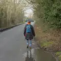 Isobel walks off towards Thrandeston, A Pub Walk to the Railway Tavern, Mellis, Suffolk - 9th February 2025