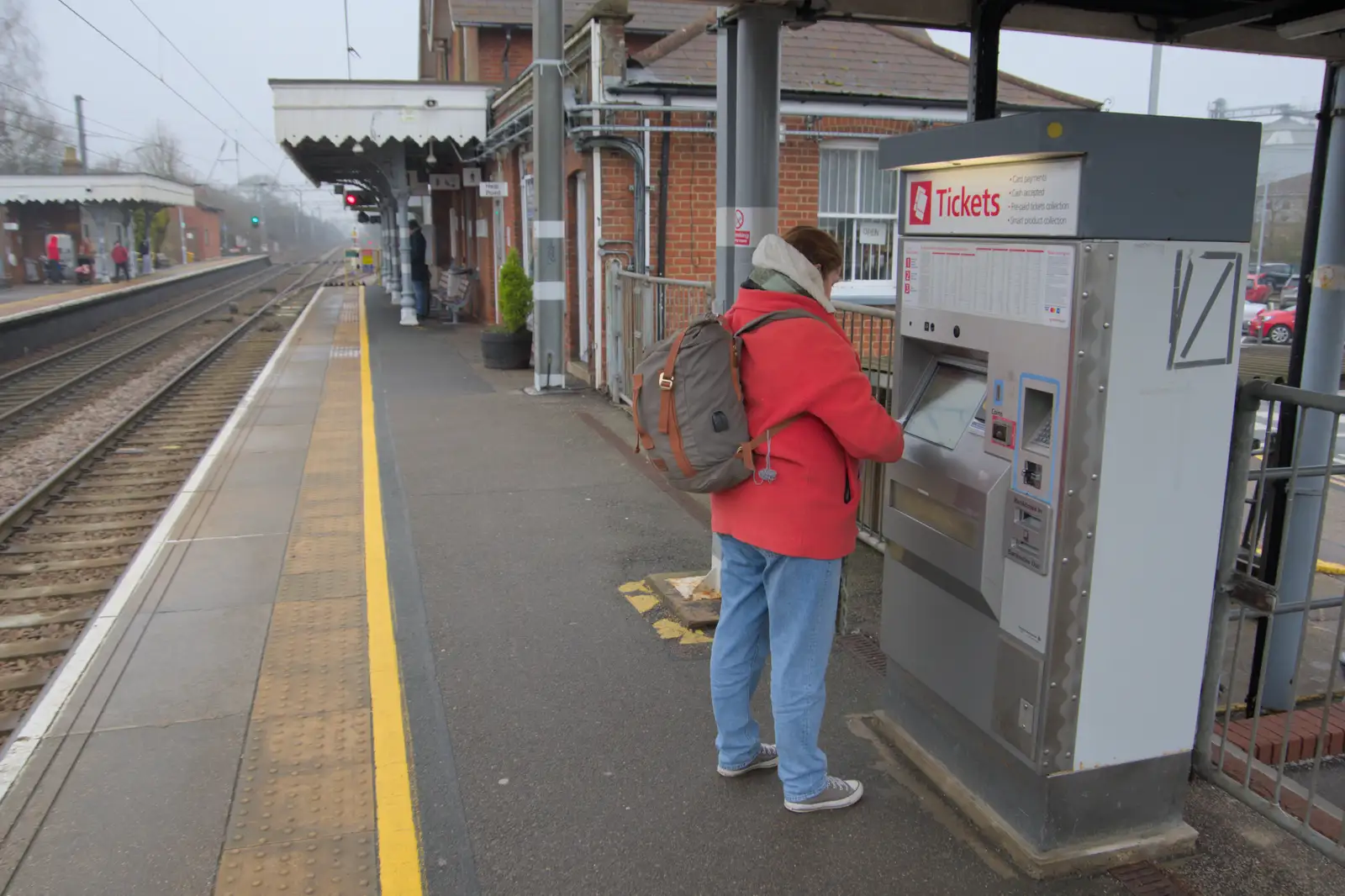 Isobel picks up her train ticket for Bristol, from A Pub Walk to the Railway Tavern, Mellis, Suffolk - 9th February 2025