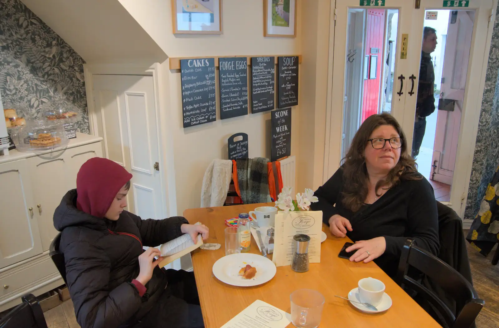 Harry reads a book as Sis looks up, from A Return to Chagford, Devon - 16th February 2025