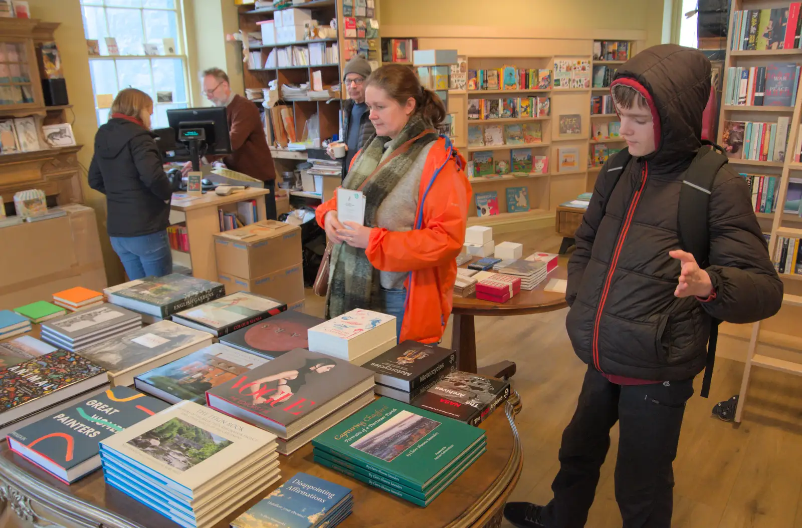 Isobel and Harry look at books in Astor's, from A Return to Chagford, Devon - 16th February 2025