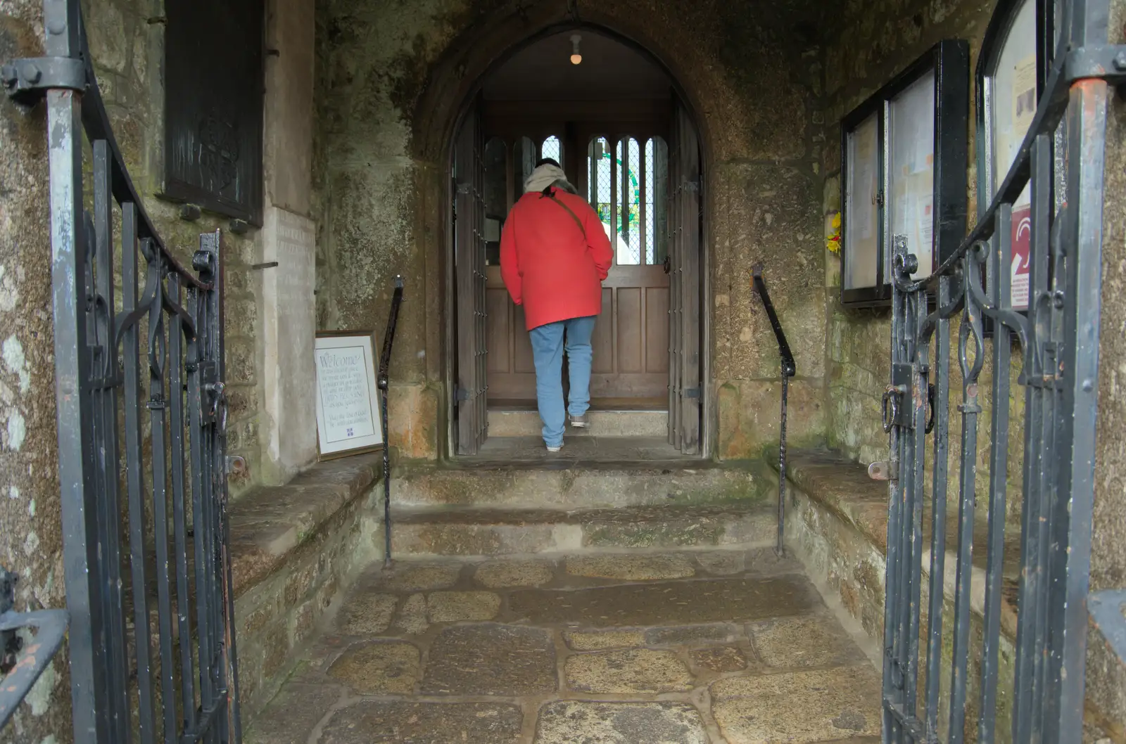 Isobel peers into St. Andrew's church, from A Return to Chagford, Devon - 16th February 2025