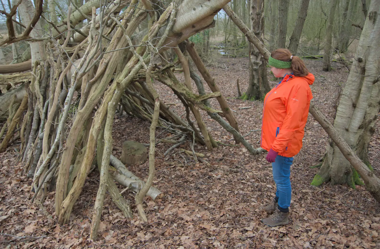 Isobel inspects a den in the woods, from A Walk around Redgrave and Lopham Fen, Redgrave, Suffolk - 23rd February 2025