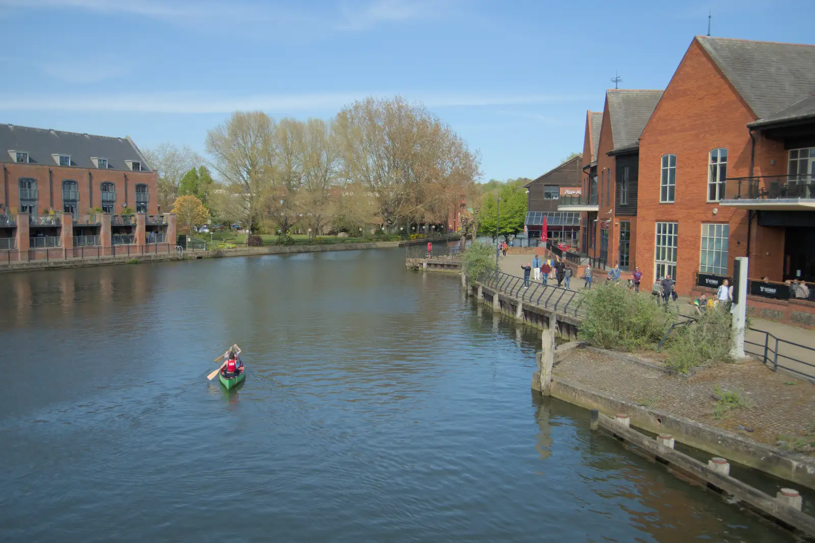 A canoe paddles up the river, from Avoiding Football in Norwich, Norfolk - 18th April 2025