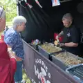David queues up for a Harris's Hog Roast roll, The GSB Play the VE Day 80th Anniversary Event, Gislingham, Suffolk - 11th May 2025