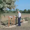 Mick the Brick checks the memorial on the airfield, The BSCC at the Greyhound, Botesdale, Norfolk - 15th May 2025