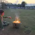 Harry pokes the barbeque, Camping at Weybread, and the BSCC at Rushall, Norfolk - 29th May 2025