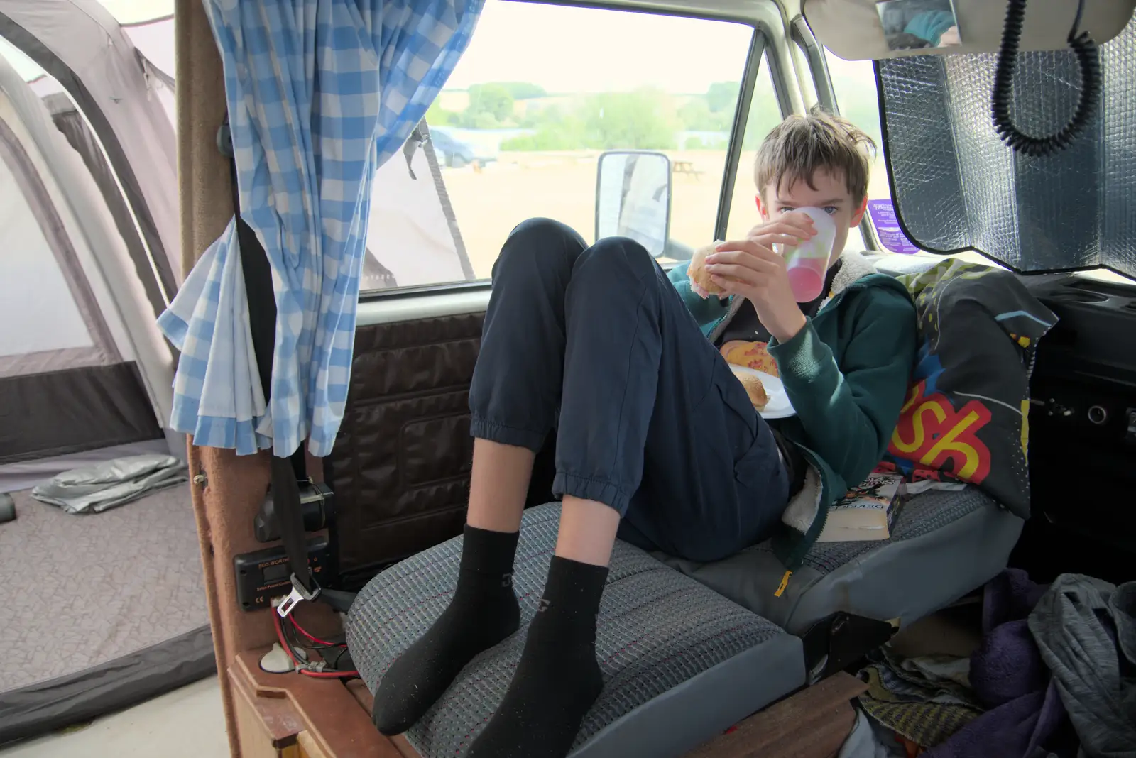 Harry has a drink in the van, from Camping at Weybread, and the BSCC at Rushall, Norfolk - 29th May 2025