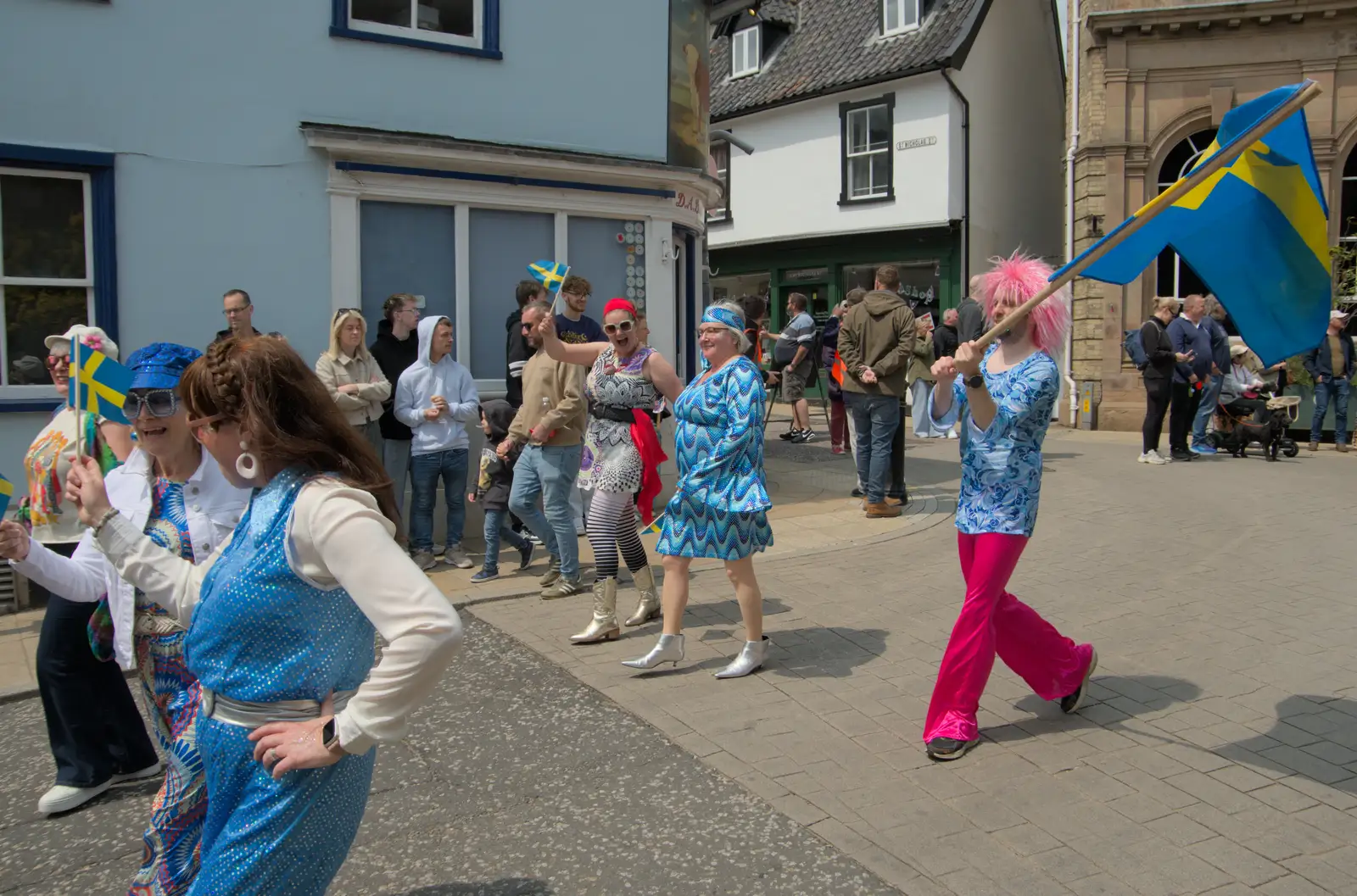 Isobel waves as the Players pass Brownes, from Palgrave Players do the Carnival, Diss, Norfolk - 8th June 2025