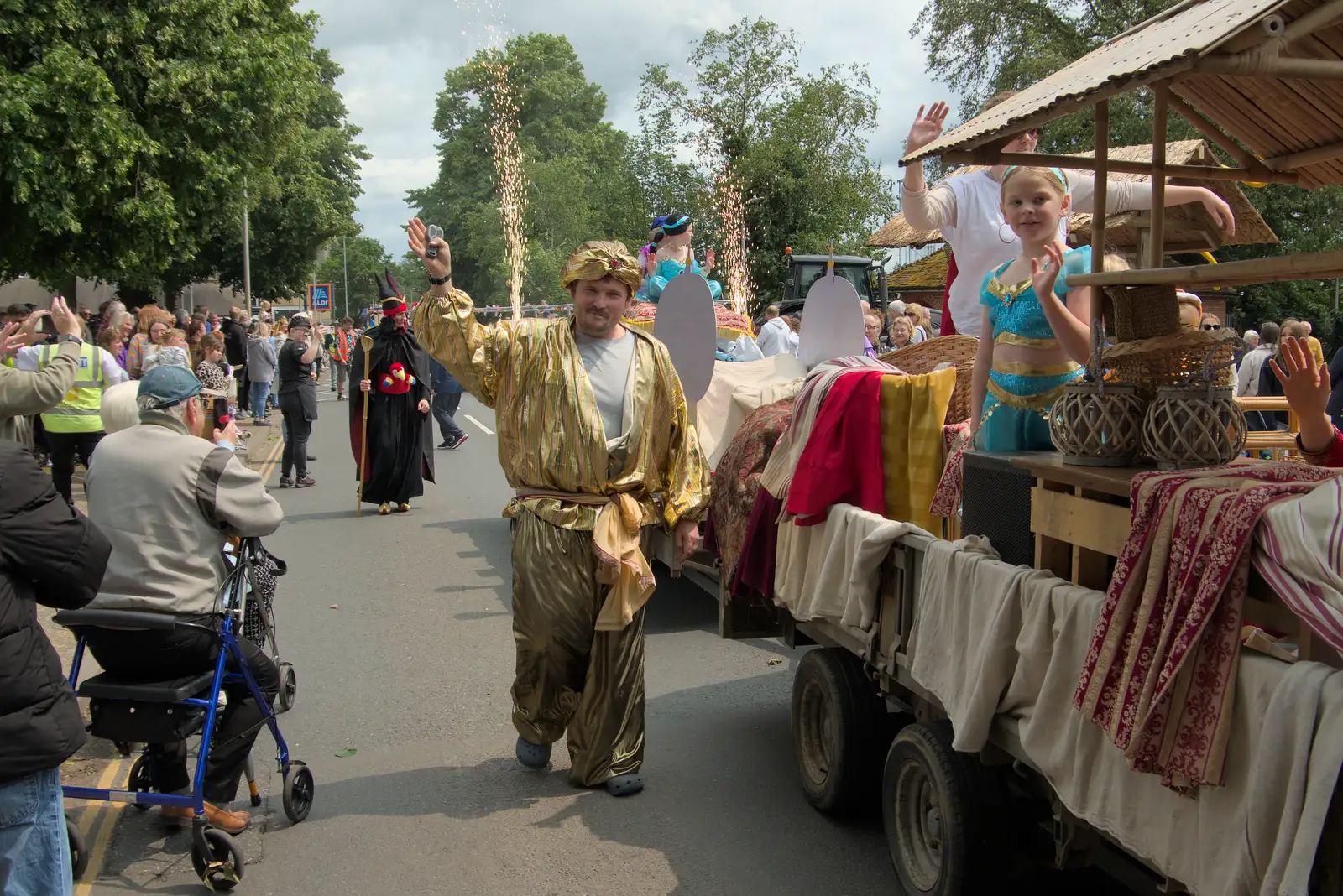A dude in a gold suit waves, from Palgrave Players do the Carnival, Diss, Norfolk - 8th June 2025