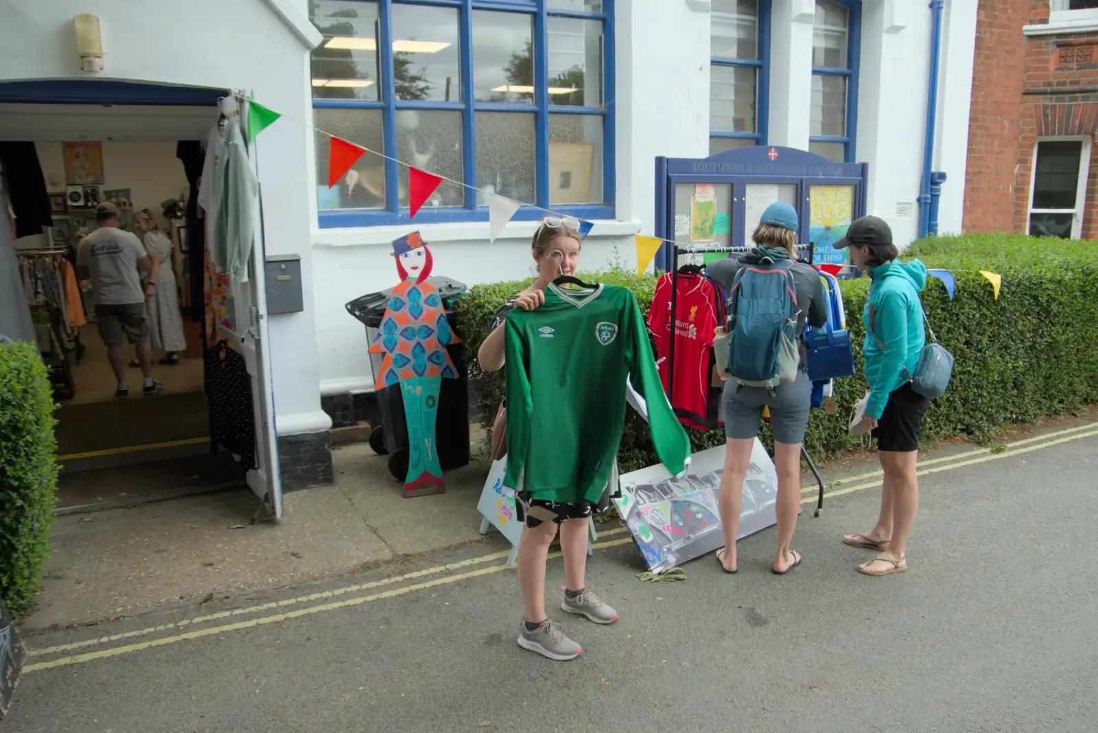 Isobel holds up an Irish sports shirt, from Harry's Karate Kamp, Blackshore, Southwold - 5th July 2025
