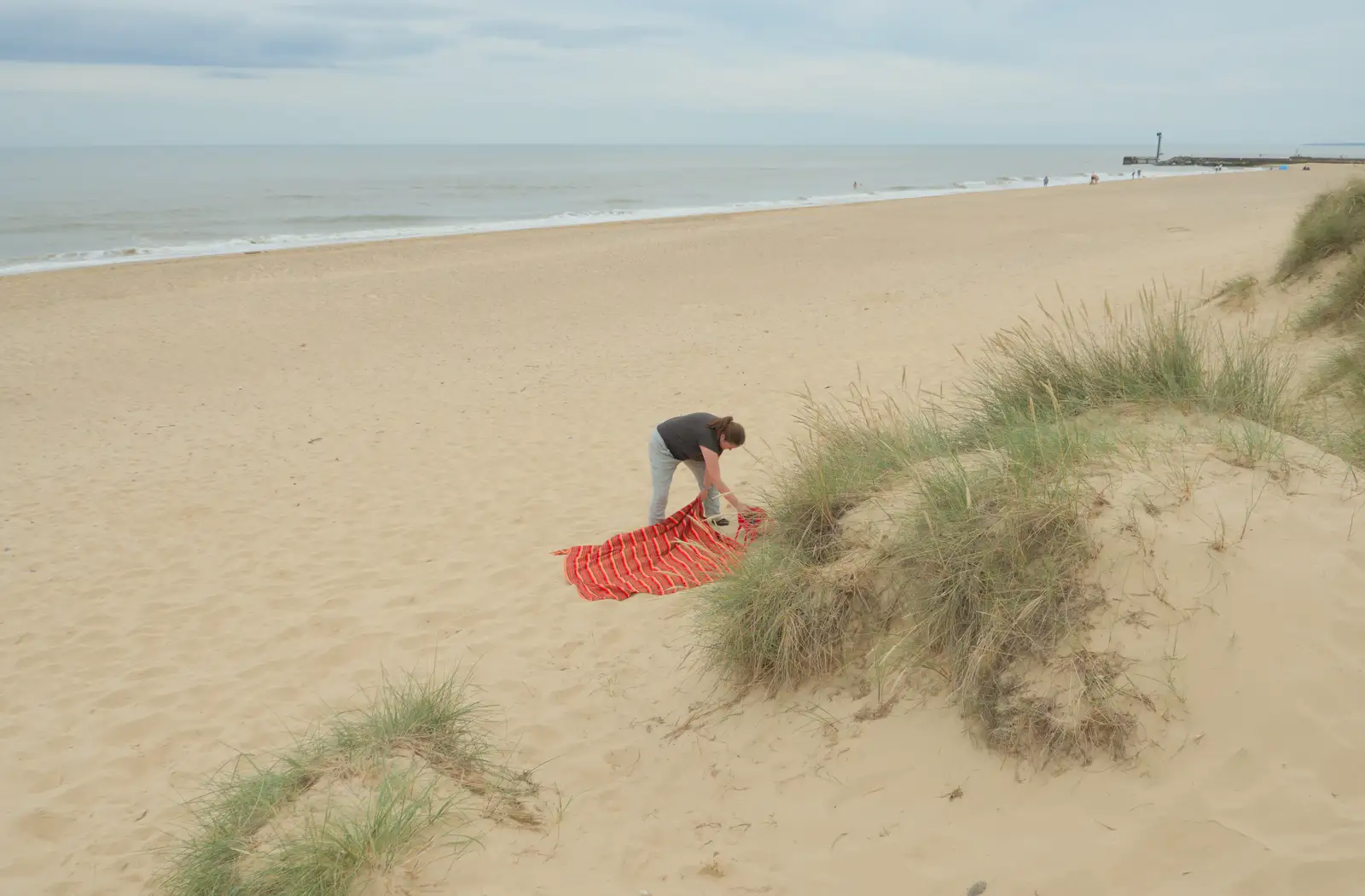Isobel lays out a blanket on the beach, from Harry's Karate Kamp, Blackshore, Southwold - 5th July 2025