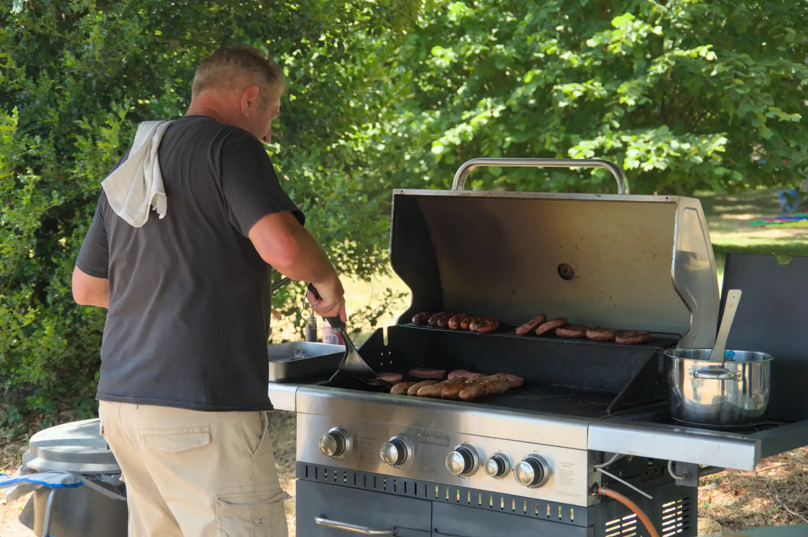 It's sausage time on the barbeque, from The Brome and Oakley Fete, Brome Hall, Suffolk - 12th July 2025