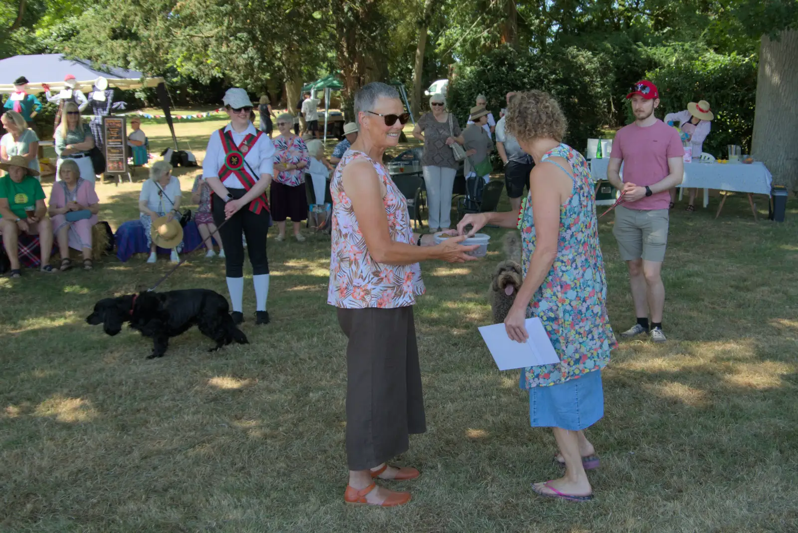 Pippa hands out some more dog biscuits, from The Brome and Oakley Fete, Brome Hall, Suffolk - 12th July 2025